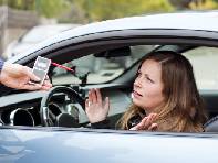 Driver taking breath test for drunk driving in Connecticut