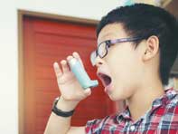 Child with asthma inhaler