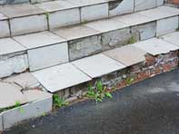 Fall hazard on broken steps of staircase